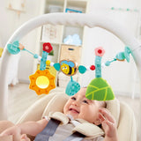 Hape Bumblebee Pram Chain for babies bassinet or pram.  Suitable for ages 0-5 months and features a hanging wooden bee, a textile sunflower, a leaf with a bell inside, wooden triangles, flowers, and colorful beads at Cerise