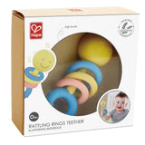 The Hape Rattling Rings Teether at Cerise its made from safe, rice-based materials. This smiling baby teething toy includes three colourful rattling rings that encourage sensory exploration, along with a teether ring to help comfort sore gums during teething.