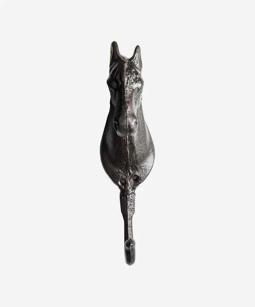 Metal horse head hook on a white background