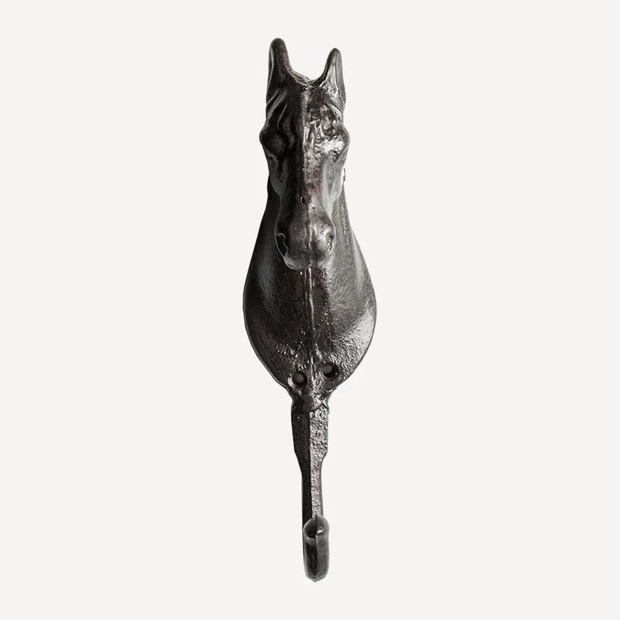 Metal horse head hook on a white background