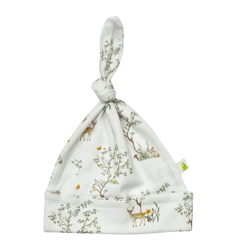 Imababy Woodland Deer Cotton knotted beanie at Cerise.  Made from 100% cotton and featuring an adjustable knot at the top so the beanie growns with baby.  