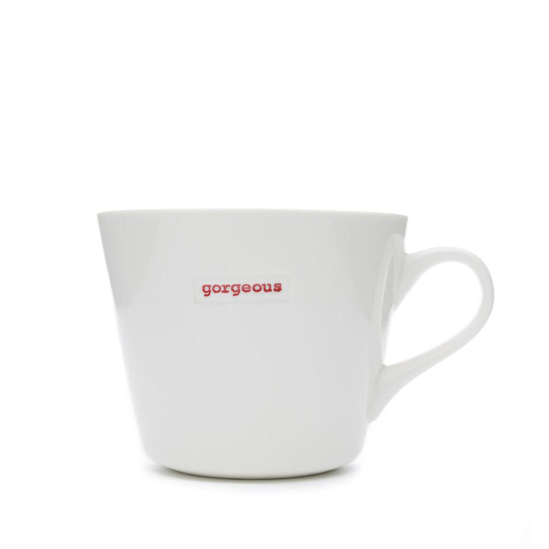 White mug with 'gorgeous' text in red on a white background
