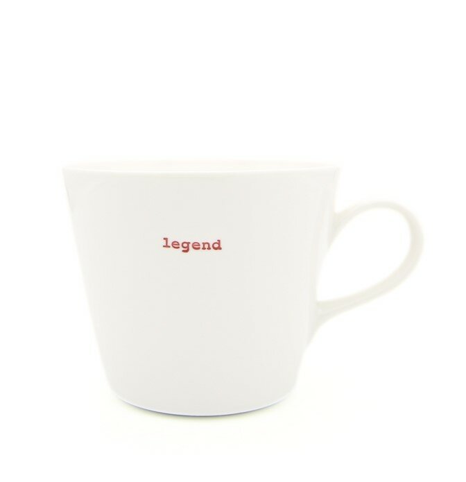 White mug with 'legend' text in red on a white background