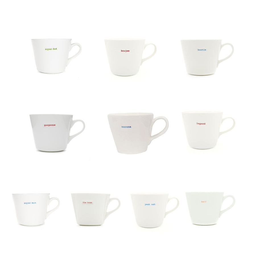 Set of white mugs with colorful text on a white background