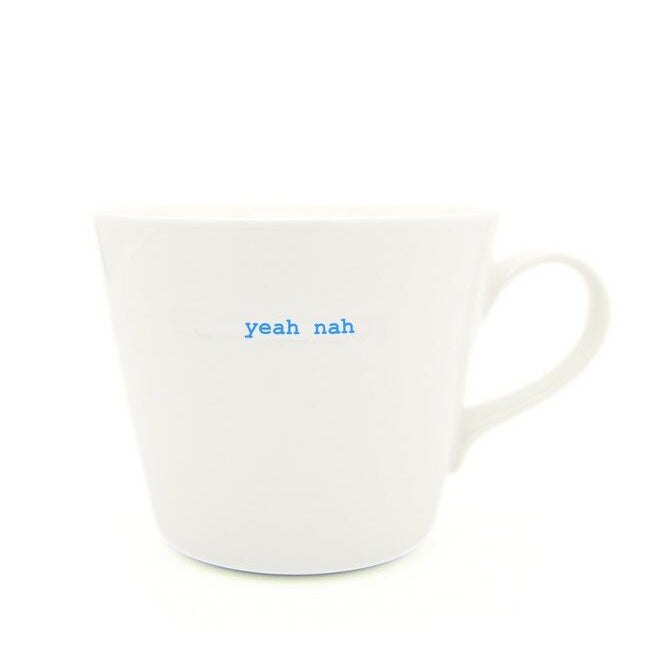 White mug with 'yeah nah' text in blue on a white background