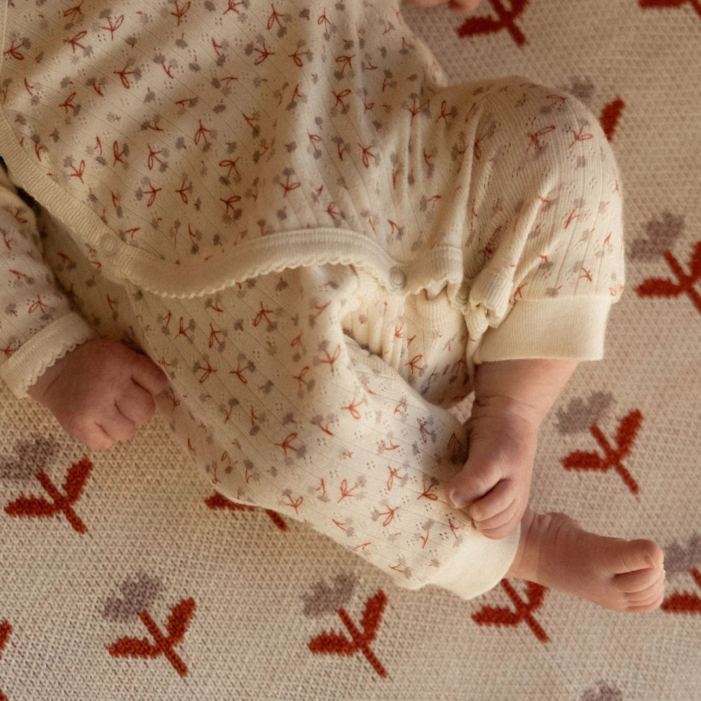 Nature Baby Kimono Stretch & Grow  in Dandelion Design Print at Cerise.  Made from 100% cotton pointelle.