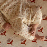 Nature Baby Kimono Stretch & Grow  in Dandelion Design Print at Cerise.  Made from 100% cotton pointelle.