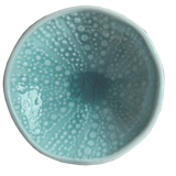 Aqua kina ceramic bowl with bubble pattern on a plain background