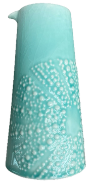 Aqua ceramic kina jug with white bubble texture on a white background