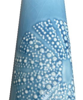 Blue ceramic kina jug with white bubble texture on a white background