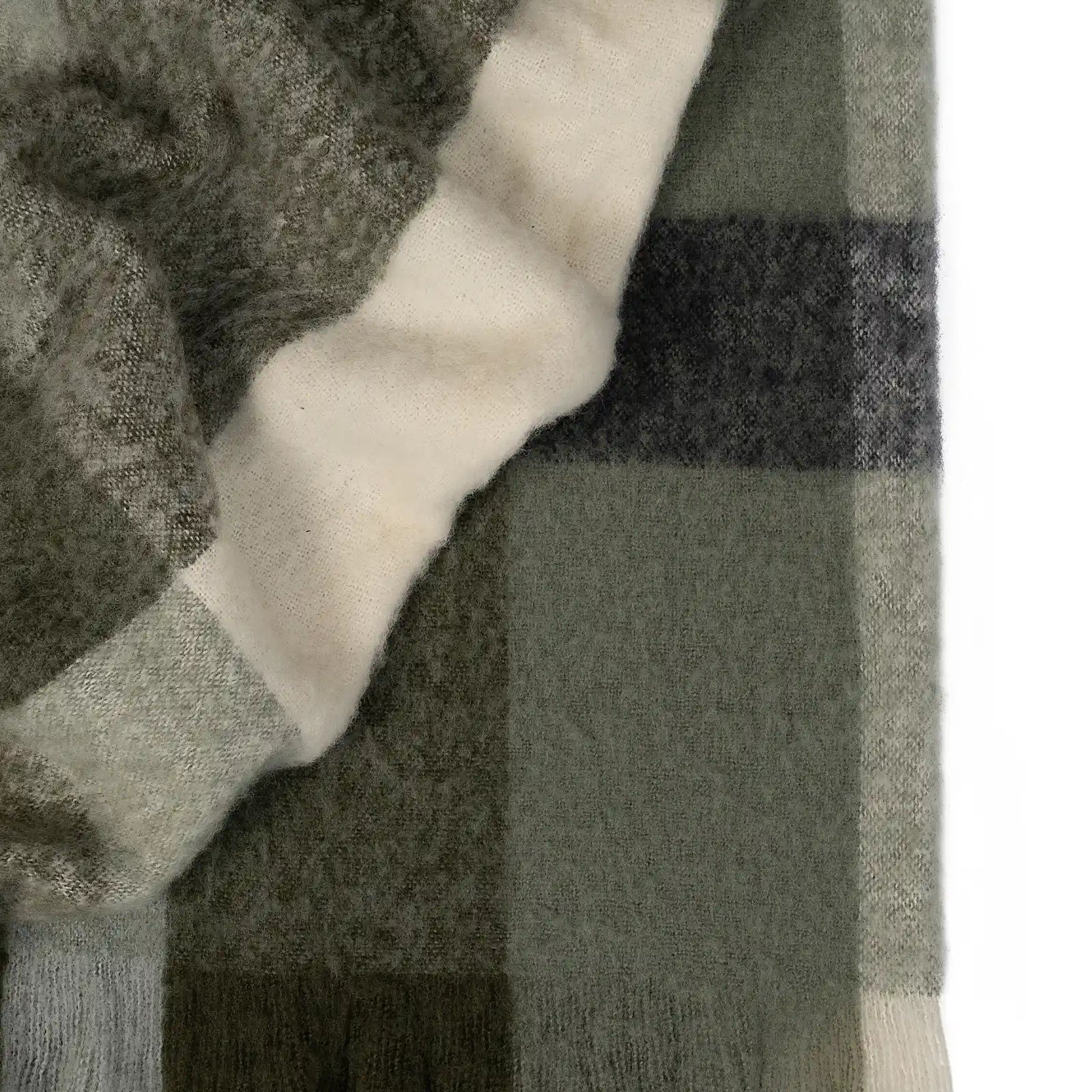 Kinloc Throw in Spruce colourway made from NZ Wool in a stunning green plaid pattern.
