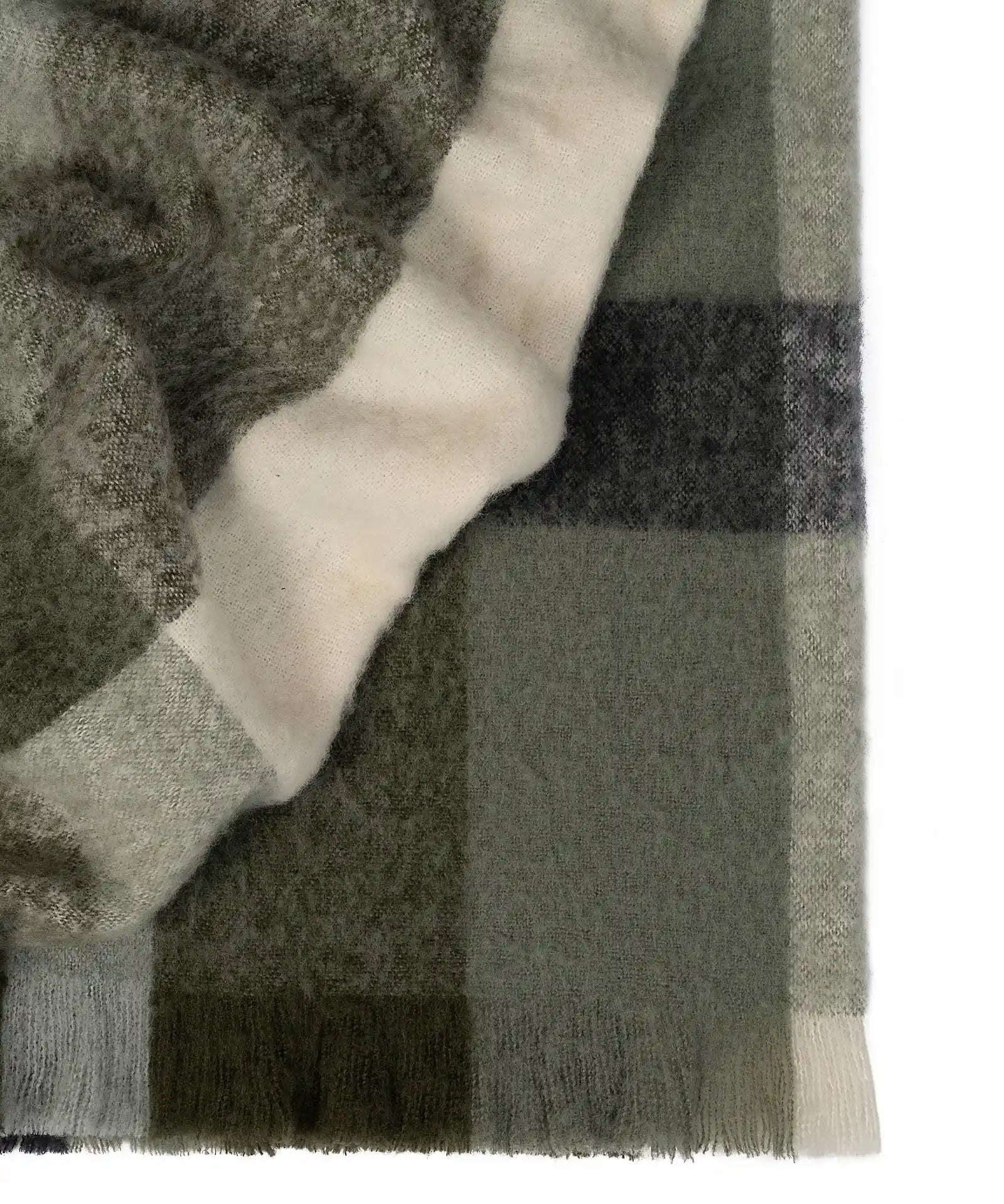 Kinloc Throw in Spruce colourway made from NZ Wool in a stunning green plaid pattern.