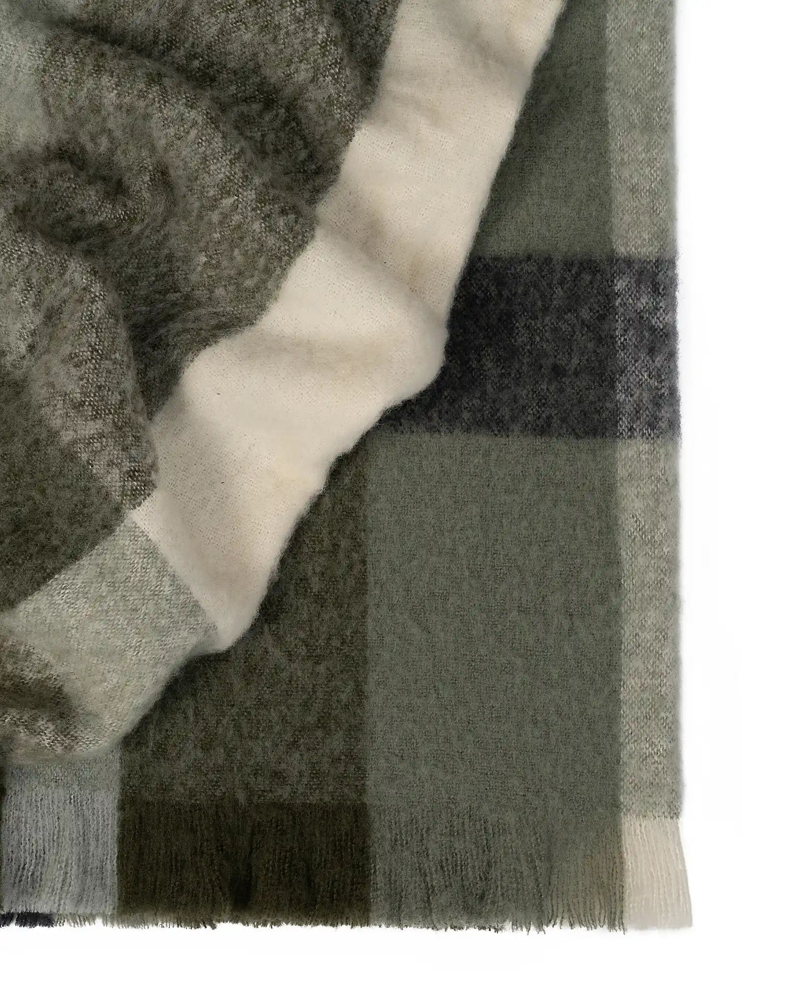 Kinloc Throw in Spruce colourway made from NZ Wool in a stunning green plaid pattern.