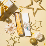 Image of a gold White Lily LIving Light mini icicle candle in a white gift box.