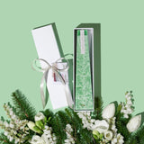 Image of a Green Pine LIving Light mini icicle candle in a white gift box.