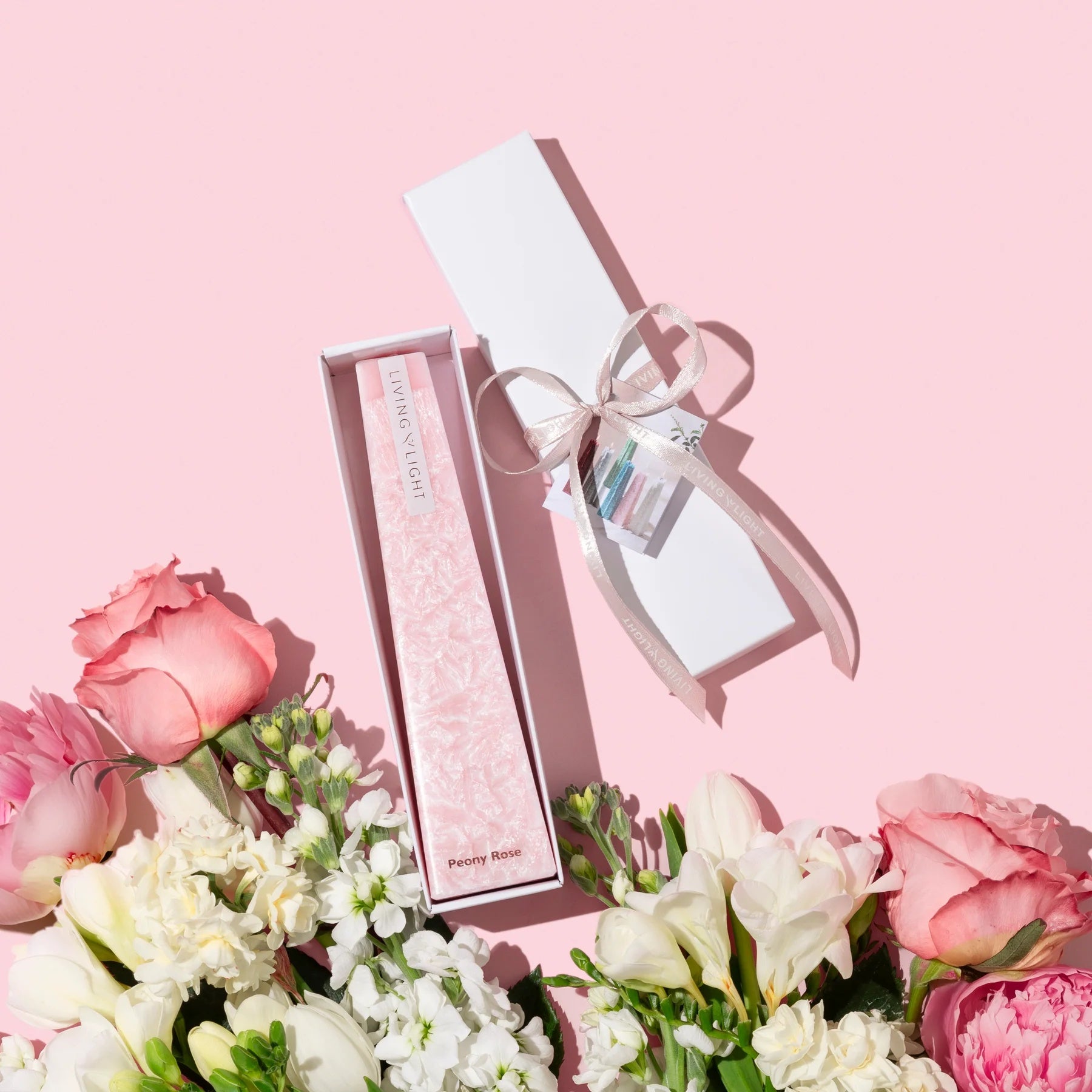 Image of a Pink Peony Rose LIving Light mini icicle candle in a white gift box.
