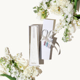 Image of a  White Pinot Blanc LIving Light mini icicle candle in a white gift box.