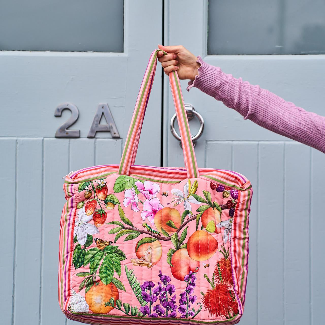 La La Land Comforter Bag in vibrant fruit and floral Bountiful Harvest print at Cerise