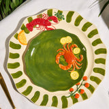 Green stoneware crab plate styled for coastal dining and summer entertaining available at Cerise