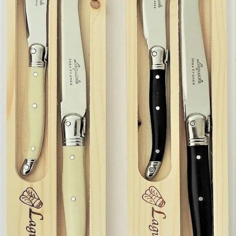 Laguiole by Jean Nerson 2 piece cheese set presented in a woden Gift ?Box at Cerise.
Available in Ivory or black resin handles, set contains one 23cm cheese knife and 1x 15cm butter knife.