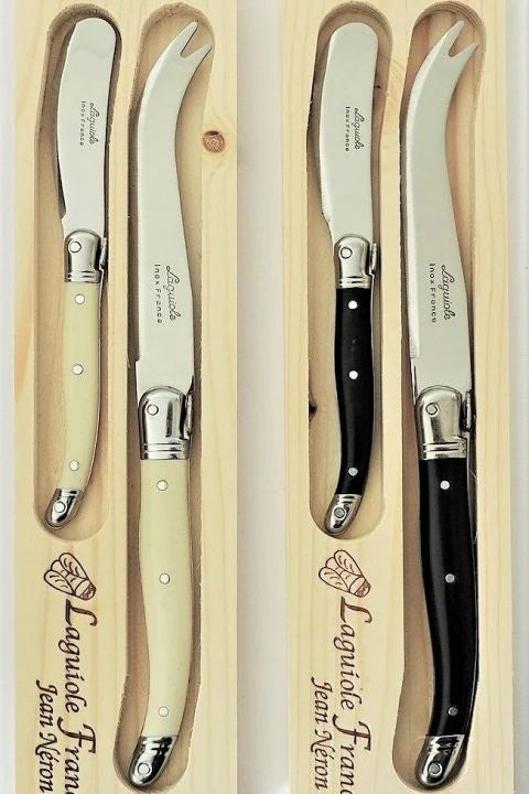 Laguiole by Jean Nerson 2 piece cheese set presented in a woden Gift ?Box at Cerise.
Available in Ivory or black resin handles, set contains one 23cm cheese knife and 1x 15cm butter knife.