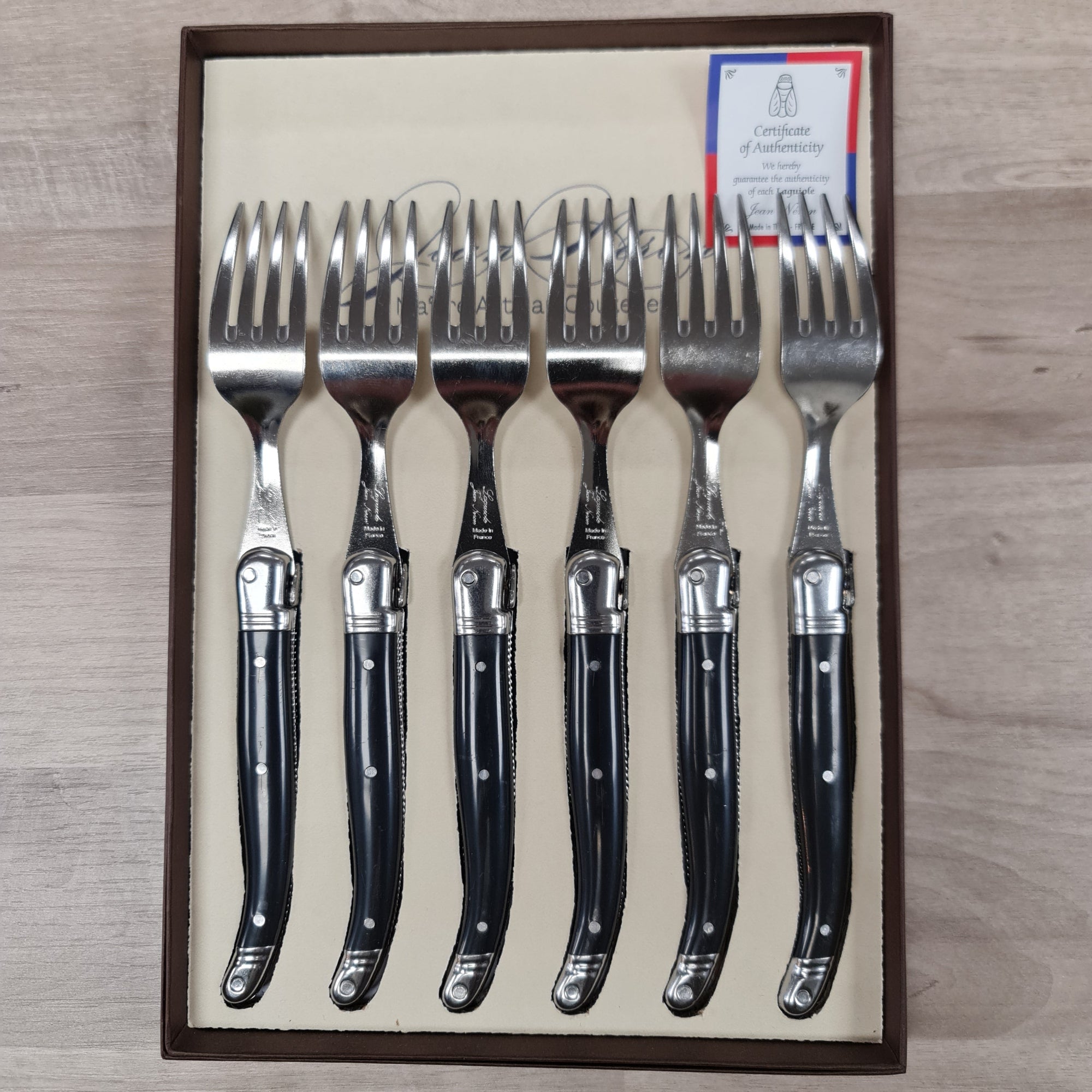 Set of 6 Laguiole by Jean Neron Black Handles table forks with bee icon.  Prresented in a gift box at Cerise NZ