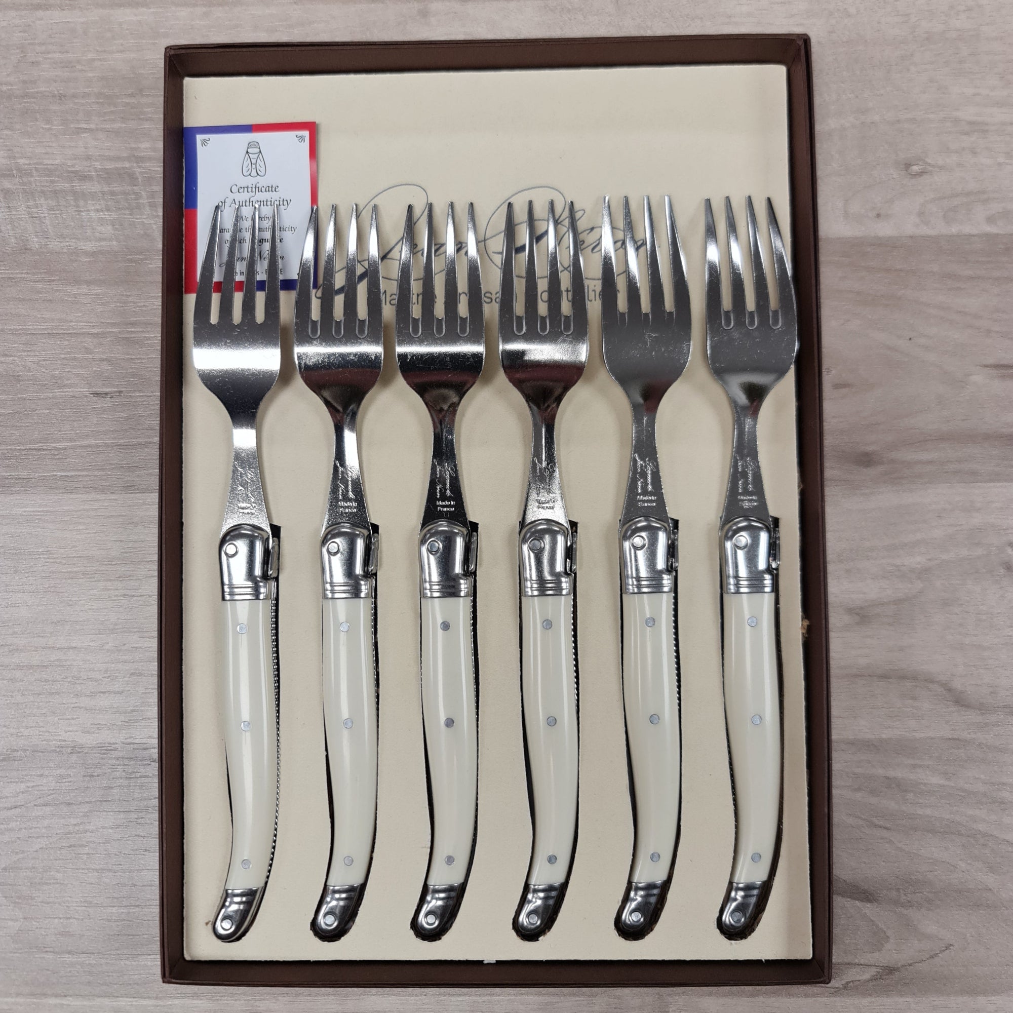 Laguiole by Jean Neron Ivory coloured handle bee icon table forks in a set of 6. Gift boxed at Cerise NZ