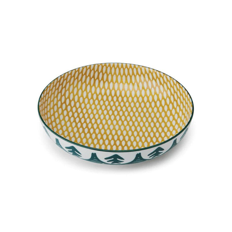 Decorative bowl with yellow pattern on green  and white tree pattern outside white background