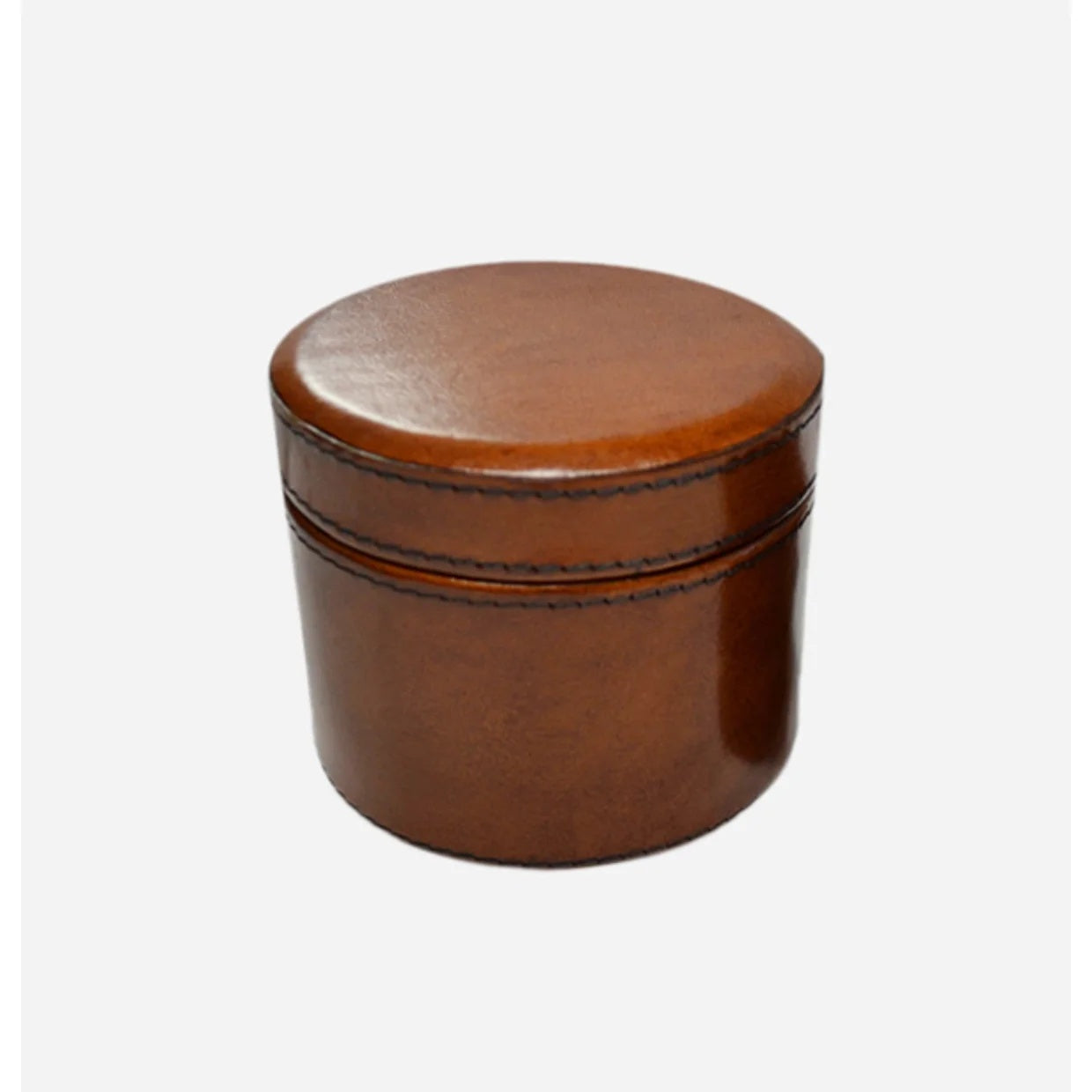 Round leather watch or trinket box  particularly popular as a gift for a Man.  Finished in tan coloured leather with top stitching, Ideal for a milestone gift such as graduation or retirement at Cerise.