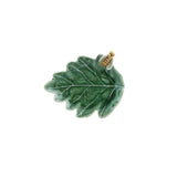 Green oak leaf-shaped dish with a gold and white bee detail o