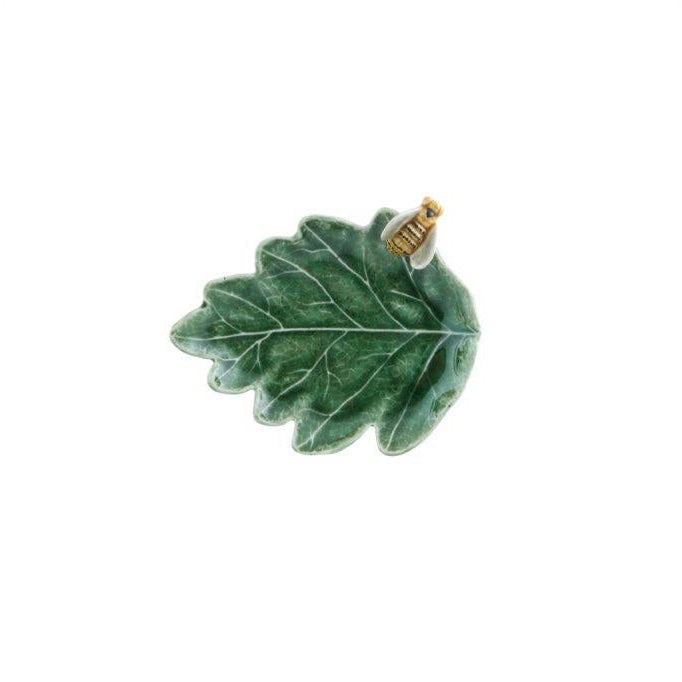 Green oak leaf-shaped dish with a gold and white bee detail o