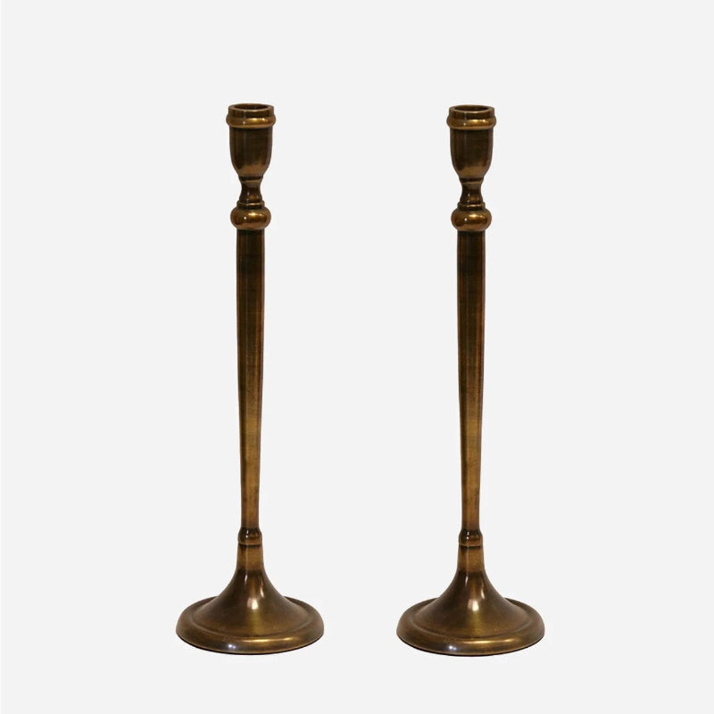 London Candlestick made of aluminium with antique brass coloured finish, measuring 370mm High.