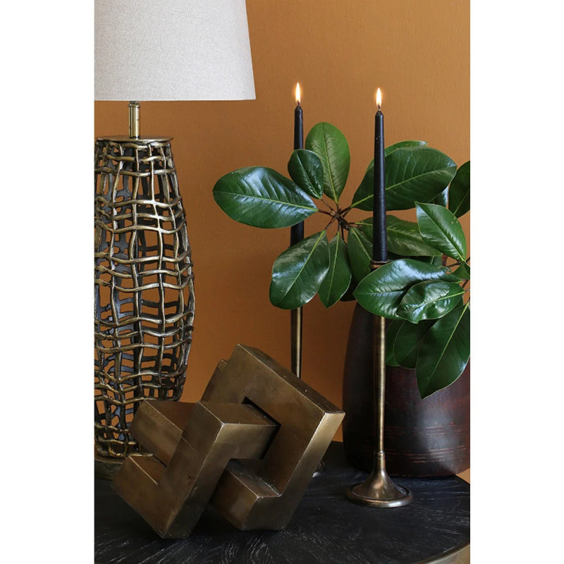 London Candlestick made of aluminium with antique brass coloured finish, measuring 370mm High.