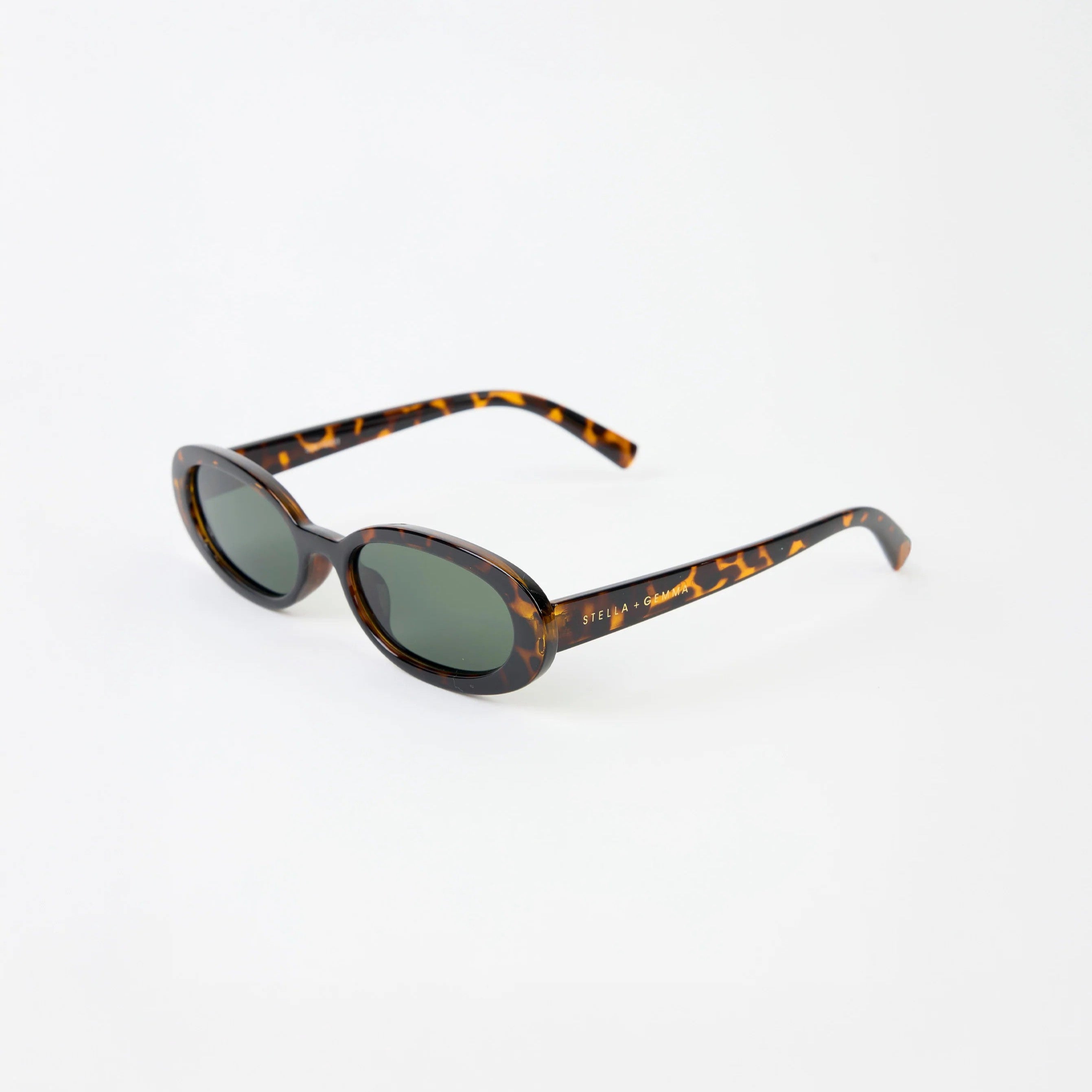 Tortoise Shell coloured oval sunglasses with Stella & Gemma Branding on arm