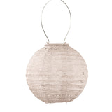 Lumiz solar lantern in a soft blush colour.  Simple round shape, measures 20cm and has a spectare pattern on the tyvek to filter light when it glows at night at Cerise