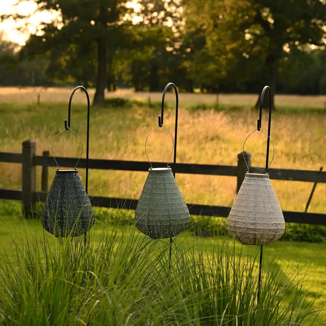 Concetpt photo of three tulip shape Lumiz hanging solar lanterns in green and soft blush at Cerise