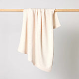 Merino Wool Knitted Baby Blanket in an Ivory colour for a perfect newborn baby  or baby shower gift at Cerise.
