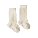 Pair of natural coloured socks on a white background