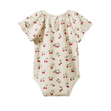 Baby romper with cherry pattern on a white background 