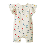 Tilly bodysuit with short legs and flutter sleeves in a floral print on a natural background - back view