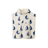 Children's hooded towel with blue sailboat pattern on a white background