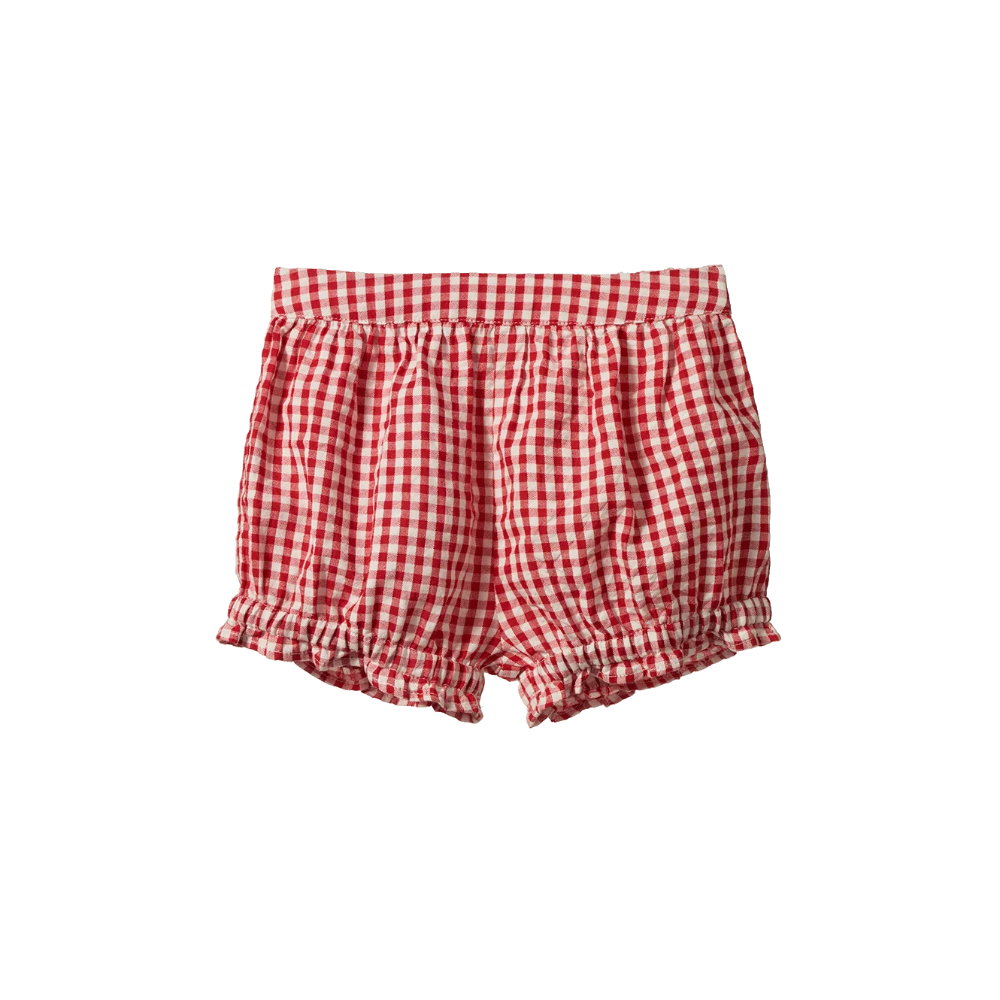 Nature Baby Betty shorts in Red Gingham print at Cerise.  Made with cotton poplin and feature cute frills around the legs and elastic waist.