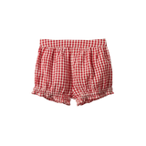 Nature Baby Betty shorts in Red Gingham print at Cerise.  Made with cotton poplin and feature cute frills around the legs and elastic waist.