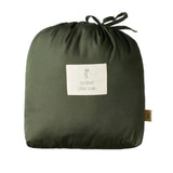 Nature Baby round playmat in drawstring carry bag at Cerise. Shown in Thyme green colour