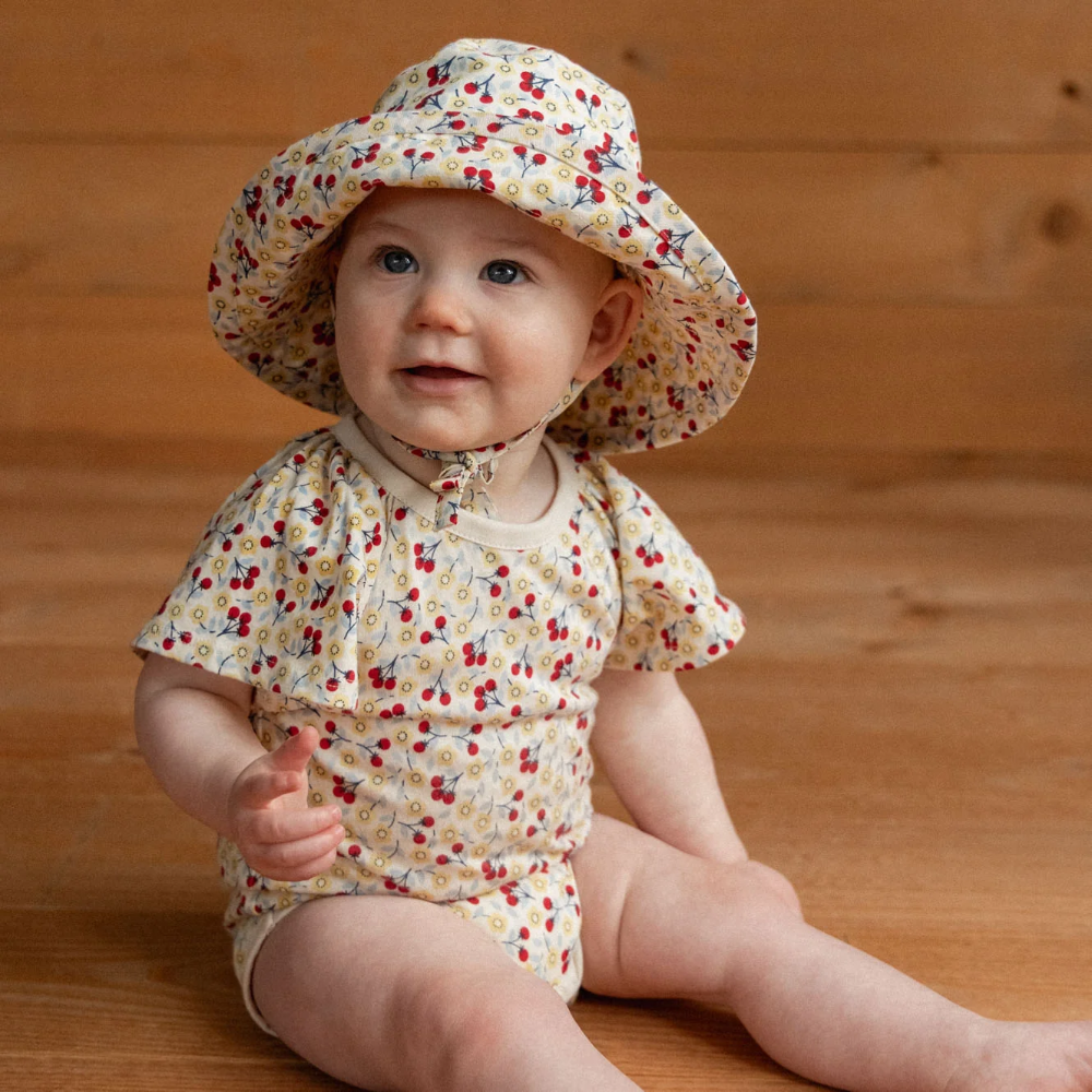 Nature Baby Holiday Sunhat in Kitchen Garden Print at Cerise