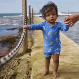 Nature Baby One Piece Bathing Trunks in Fish Fable Design at Cerise.  A great unisex design with lined body for comfort, protection from the sun for sunny days and water play