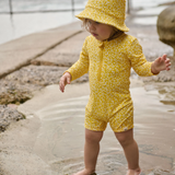 Nature Baby One Piece Bathing Trunks in Kitchen Garden Freesia Print Design at Cerise.  