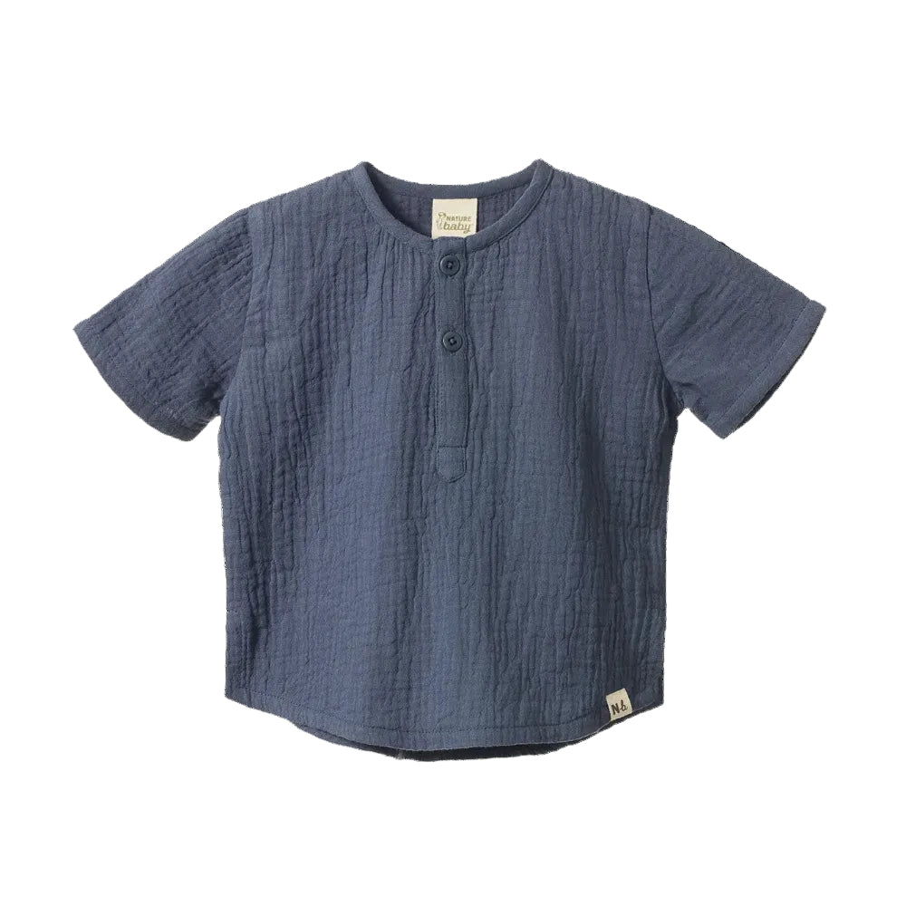Nature Baby Caravan Short Sleeved Muslin Shirt at Cerise.  Shown here in Vintage Indigo Muslin with button front.