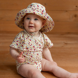 Nature Baby Faye Bodysuit in Kitchen Garden Print with flutter sleeves at Cerise