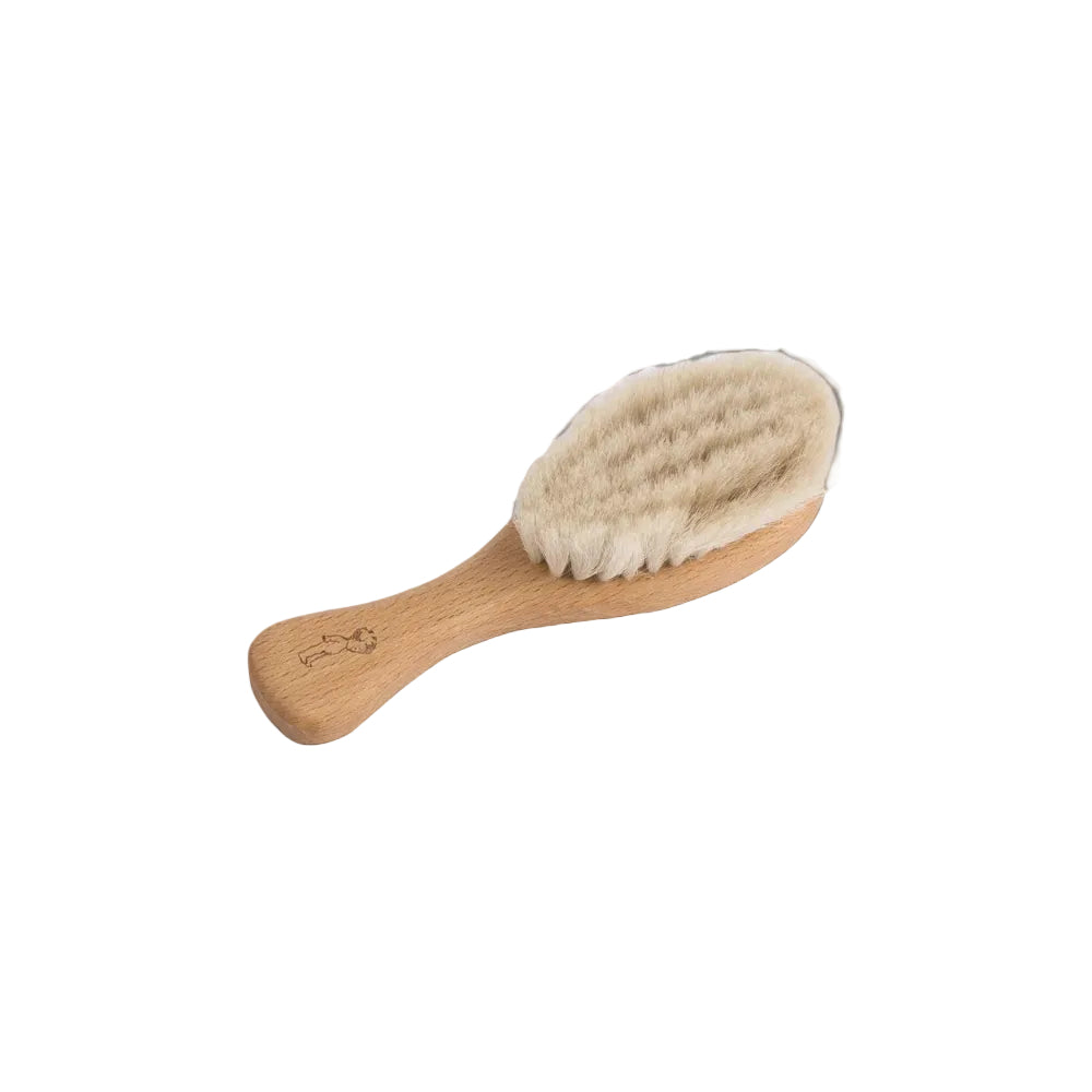 Nature Baby Hairbrush at Cerise.  Made from sustainable wood and goats har bristles for softness on babies dilicate hair.   A practical newborn baby gift.